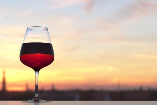 Wilts and Gloucestershire Standard: A glass of red wine in front of a sunset (Canva)