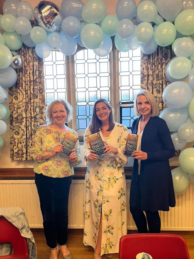 Wilts and Gloucestershire Standard: Fellow Cotswold authors Helen Yendall (L) and Anita Davison (R) made an appearance at Sophie Flynn's (centre) book launch