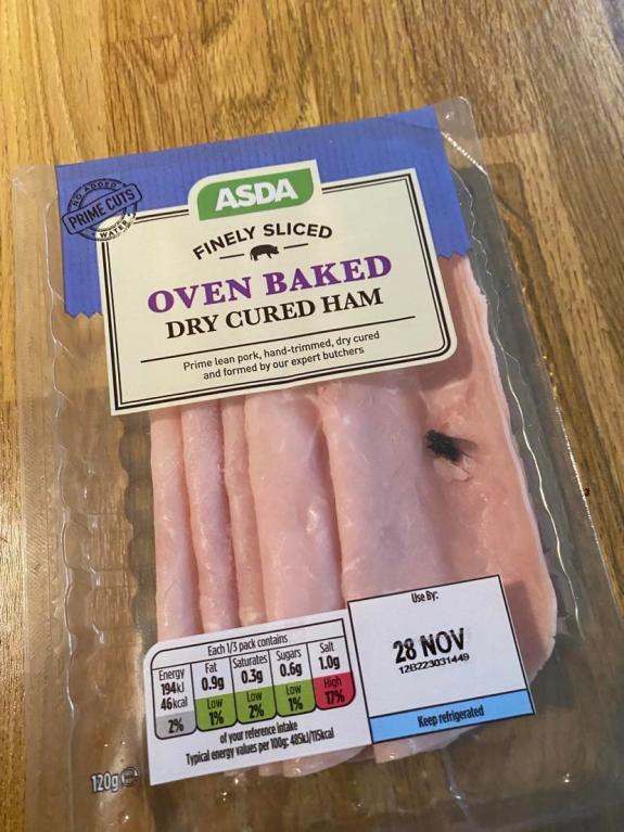 Wilts and Gloucestershire Standard: The fly in a pack of pre-packed Asda brand ham slices Wilts and Gloucestershire Standard: The fly in a pack of pre-packed Asda brand ham slices