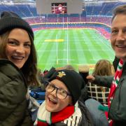 Sophie Delaney (left), her husband Andrew (right), and their son Joey (centre), at the Wales vs Australia game