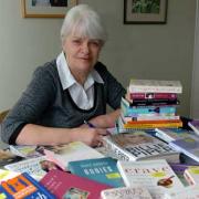 Pat Ayres with some of the eating disorder books she lends out