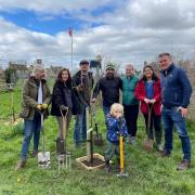 Latton Jubilee Garden driving force Jackie Blain (2nd from right) and her band of volunteers enjoyed a productive morning planting apple trees.