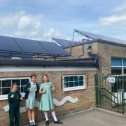 Pupils at St Joseph's Catholic Primary School in Malmesbury next to the new solar panels