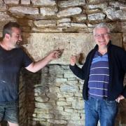 Darren Smith and Cllr Robert Hastings next to the mysterious stone