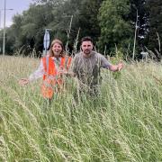 Cllr Joe Harris and Cllr Lisa Spivey in an overgrown verge in Cirencester