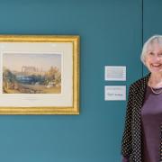 Sharon Nolan next to Turner's Malmesbury Abbey painting
