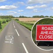 A road near Cirencester has closed after a lorry careered off the road into a field