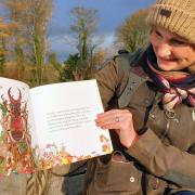Dinah Mason Eagers with one of the illustrations by Anna Platts of Thunder the stag beetle