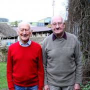 Malcolm and his brother John outside Harcombe Farmhouse, in the same place where the photo used on the front cover of Malcolm’s War was taken