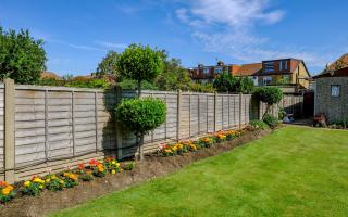 What is the maximum height of a garden fence in the UK?
