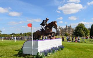 Tom Rowland and Possible Mission in action during the Dressage on day two of the 2023 Defender Burghley Horse Trials